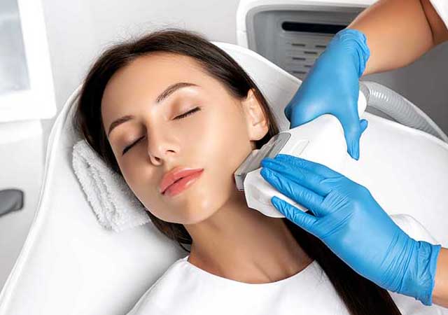 Woman getting skin sun damage treatment