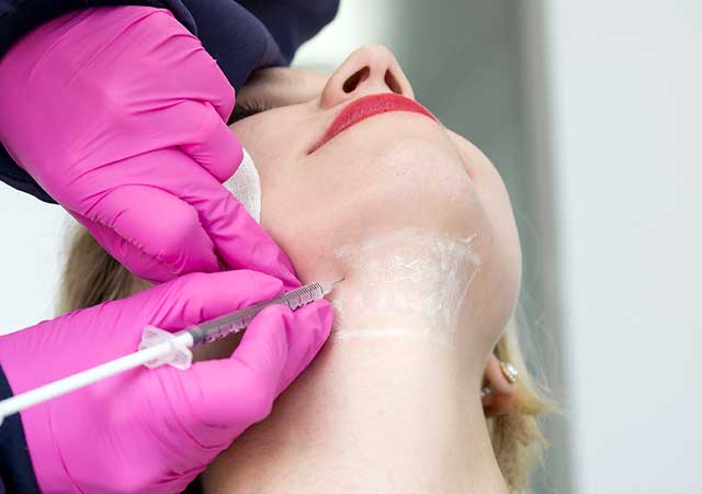 Woman getting Kybella treatment