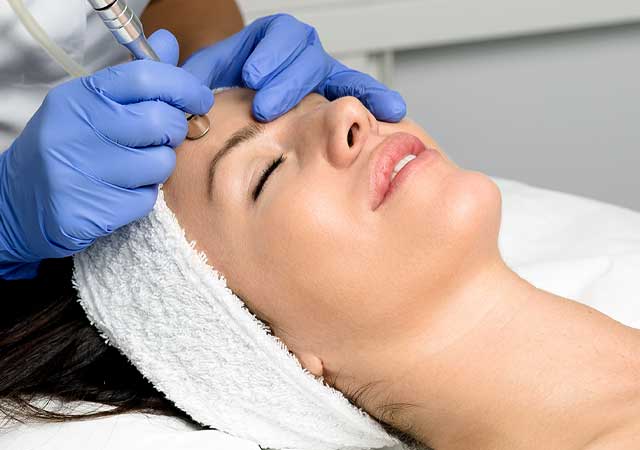 Woman Getting Microdermabrasion Treatment